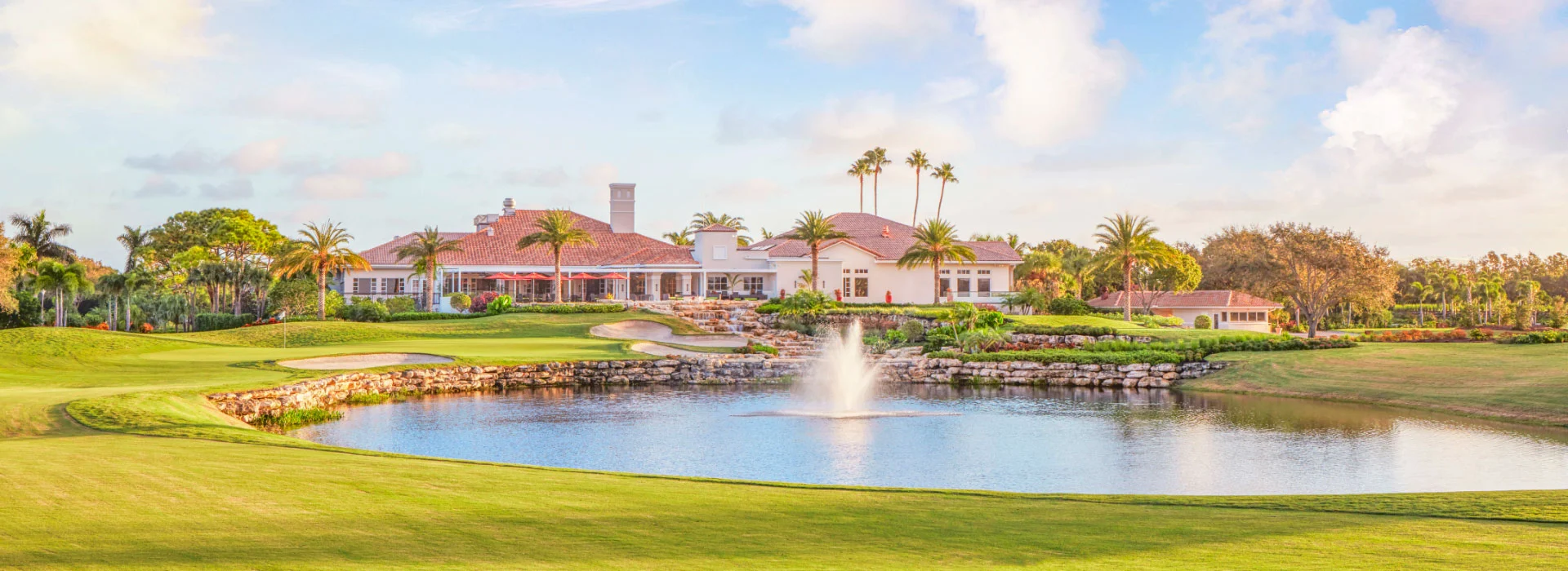 Admirals Cove Clubhouse and water fountain by the golf course
