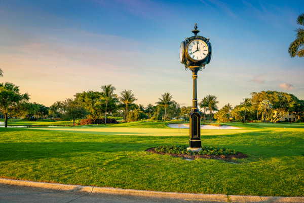 a clocktower on a golf course in Palm Beach Gardens